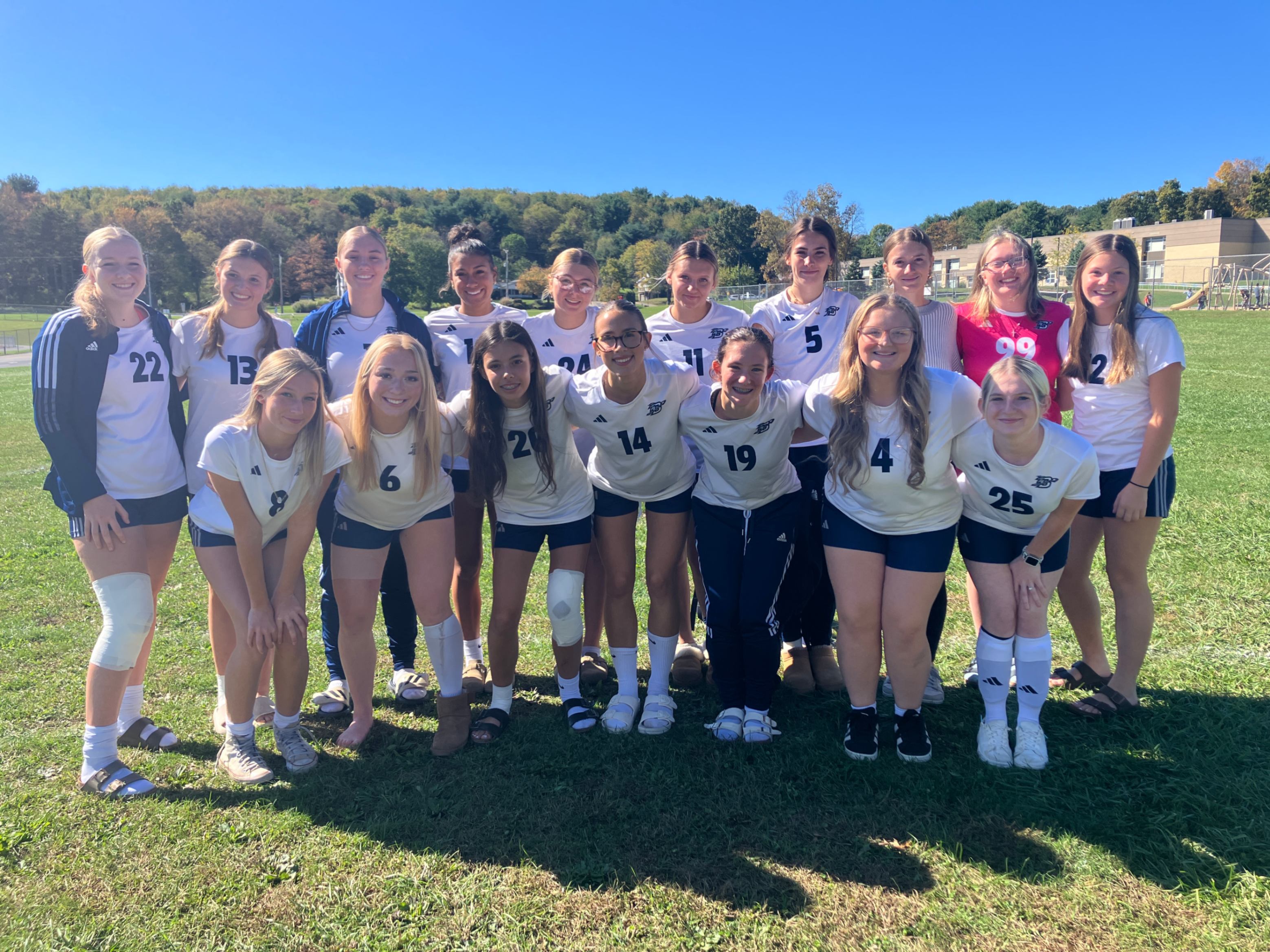 The girls soccer team poses for a photograph.